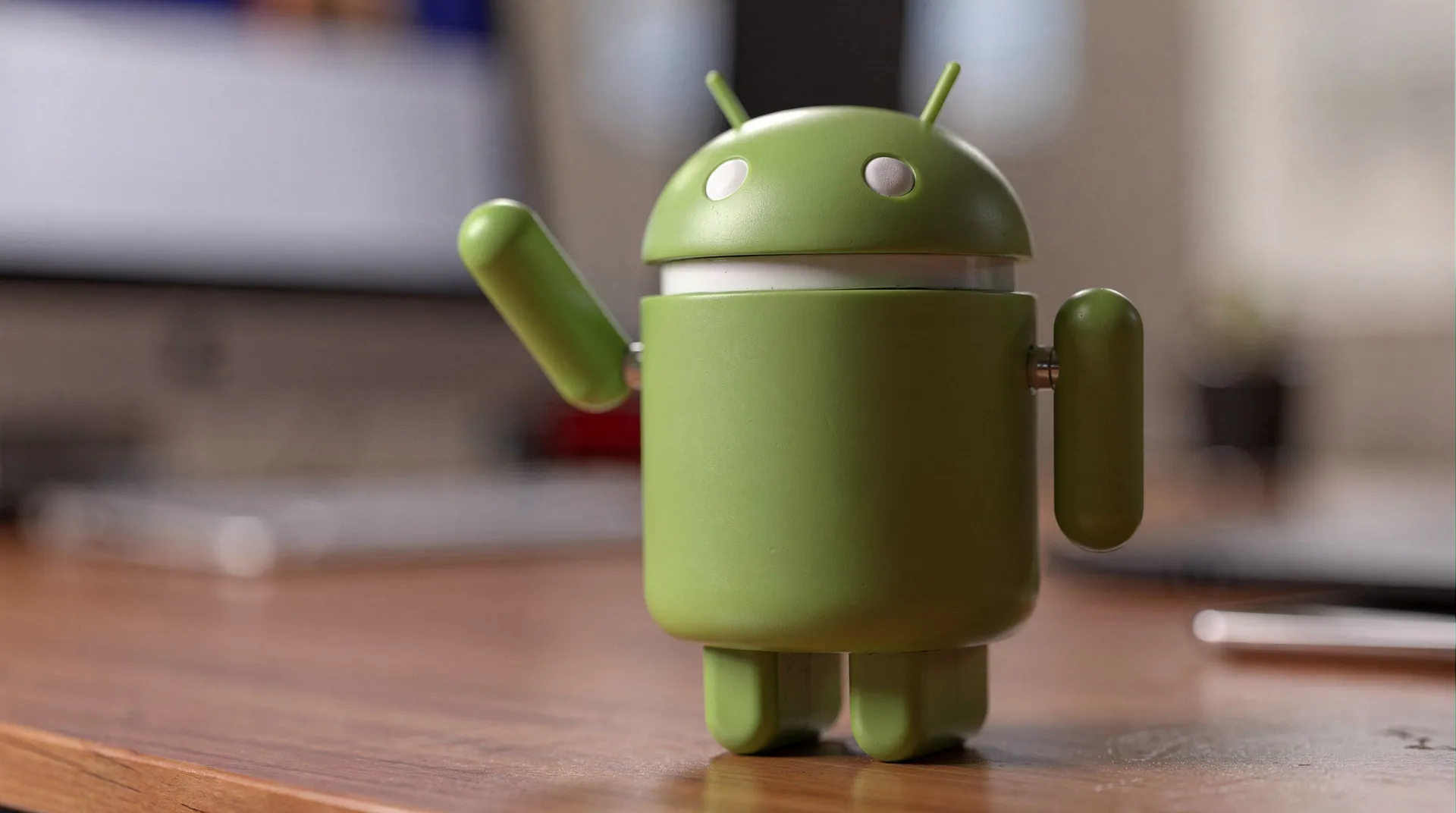 Android Security Bulletin June 2026 page open on a laptop with an Android phone showing the Security update screen